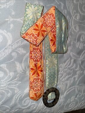 Hadley Pollet Woven Floral Sash in Orange and Teal with Carved Ring Accent